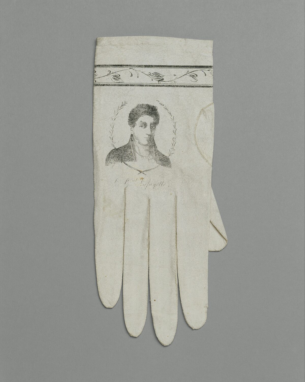 Ivory kid leather gloves with fine decorative cuffs and button detailing
